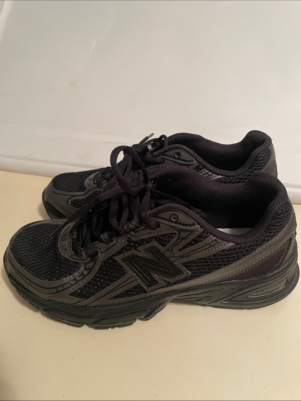 Men’s New Balance 740 sneaker in an all-black colorway,